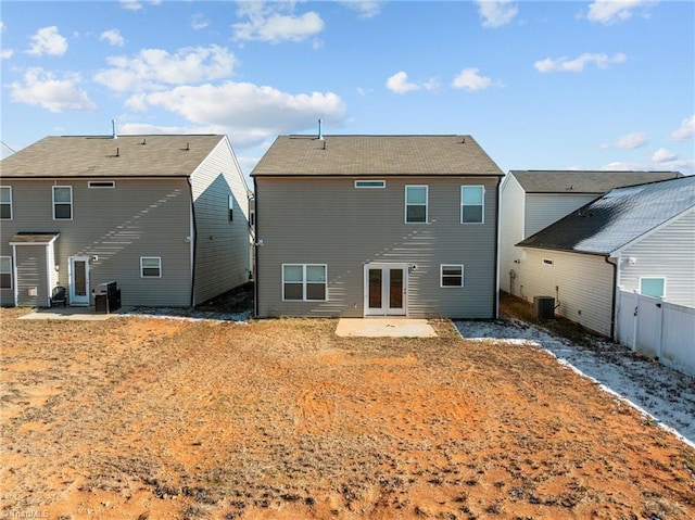 rear view of house featuring central AC, a yard, a patio, and fence