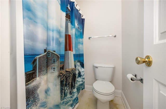 full bath with tile patterned flooring, baseboards, and toilet