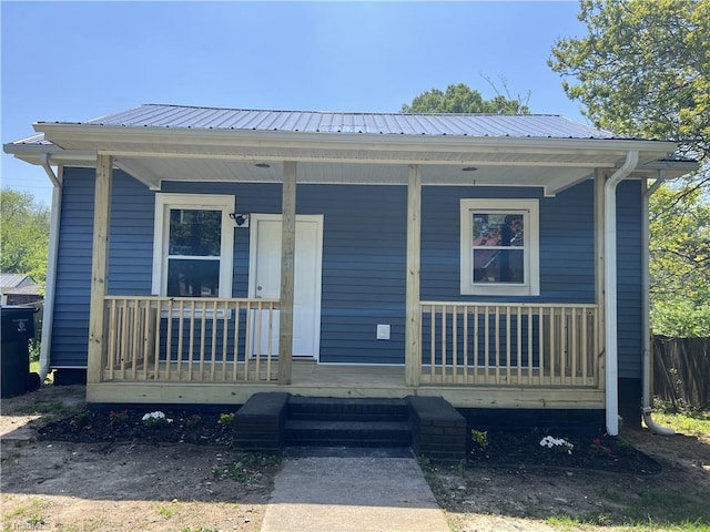 view of front of property with covered porch and metal roof