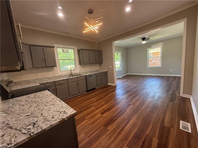 kitchen featuring stove, gray cabinets, stainless steel dishwasher, a sink, and visible vents
