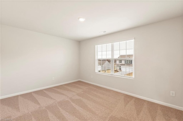 unfurnished room with carpet floors