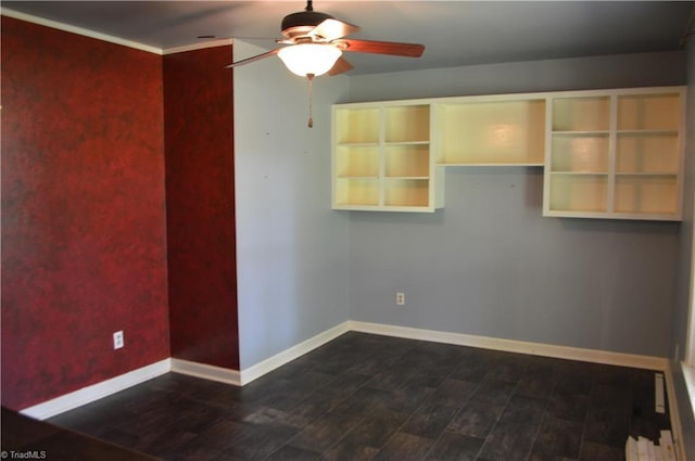 117 Ridgecrest Dr, Mount Airy, NC 27030 - spare room with baseboards, dark wood-type flooring, and ceiling fan