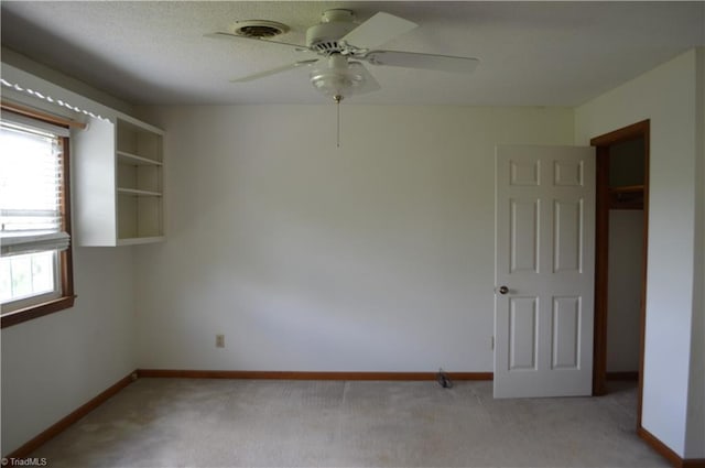 117 Ridgecrest Dr, Mount Airy, NC 27030 - spare room featuring baseboards, light carpet, and a ceiling fan
