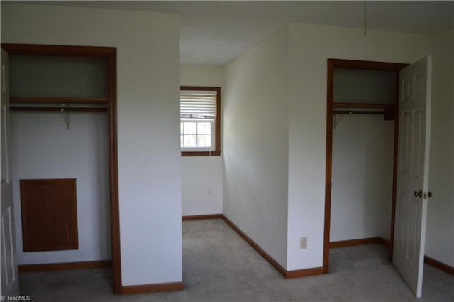 117 Ridgecrest Dr, Mount Airy, NC 27030 - unfurnished bedroom with baseboards, light carpet, and a closet