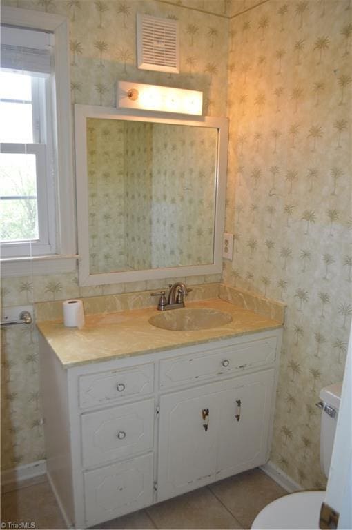 117 Ridgecrest Dr, Mount Airy, NC 27030 - bathroom featuring visible vents, vanity, baseboards, toilet, and wallpapered walls