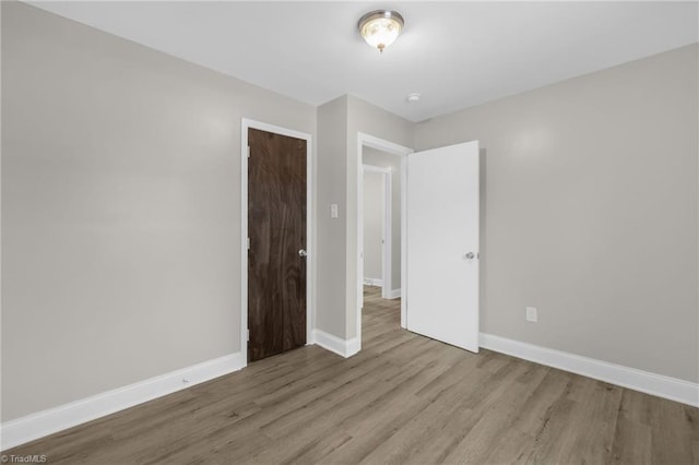 unfurnished bedroom featuring light hardwood / wood-style floors