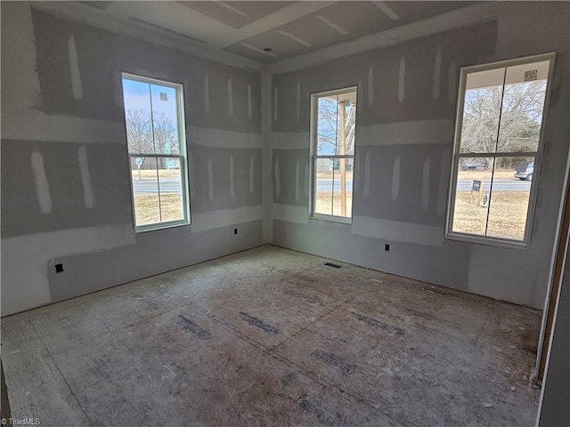 unfurnished room featuring plenty of natural light