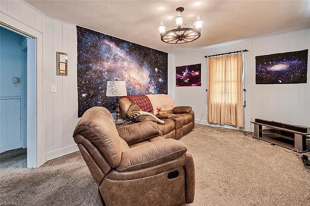 carpeted living room featuring a textured ceiling and a notable chandelier