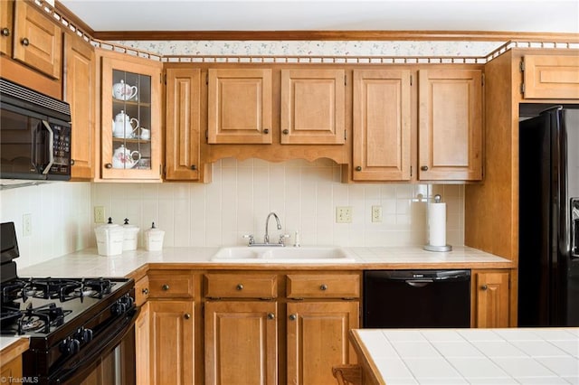 102 Shawnee Cir, Lexington, NC 27295 - kitchen featuring black appliances, a sink, backsplash, tile counters, and glass insert cabinets