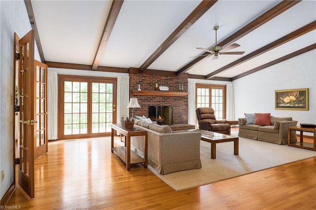 102 Shawnee Cir, Lexington, NC 27295 - living room featuring light wood-style floors, healthy amount of natural light, ceiling fan, and a fireplace