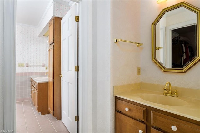 102 Shawnee Cir, Lexington, NC 27295 - bathroom with wallpapered walls, vanity, tile patterned floors, ornamental molding, and a spacious closet