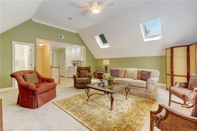 4208 Bitternut Trl, Greensboro, NC 27410 - living area featuring a skylight, lofted ceiling, light carpet, a ceiling fan, and baseboards