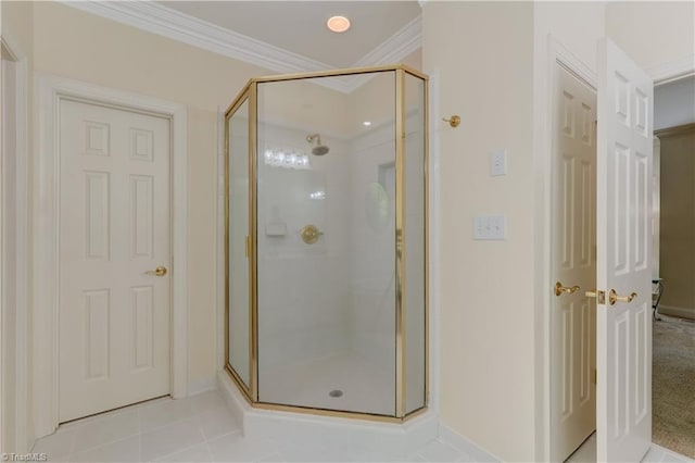 4208 Bitternut Trl, Greensboro, NC 27410 - bathroom with a stall shower, crown molding, baseboards, and tile patterned flooring
