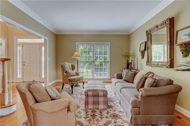 4208 Bitternut Trl, Greensboro, NC 27410 - living room featuring wood finished floors, crown molding, and baseboards