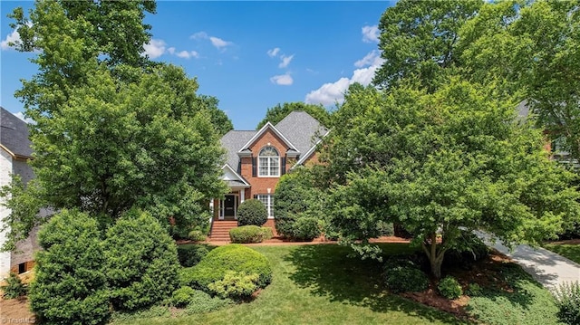 4208 Bitternut Trl, Greensboro, NC 27410 - view of front of property featuring a front yard and brick siding