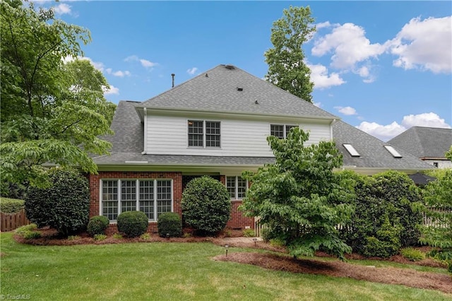 4208 Bitternut Trl, Greensboro, NC 27410 - rear view of house featuring brick siding, a yard, and a shingled roof