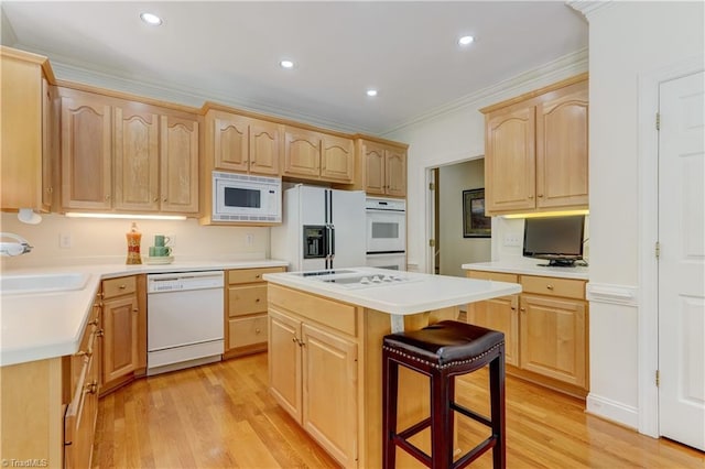 4208 Bitternut Trl, Greensboro, NC 27410 - kitchen featuring light brown cabinets, white appliances, a sink, light wood finished floors, and a center island