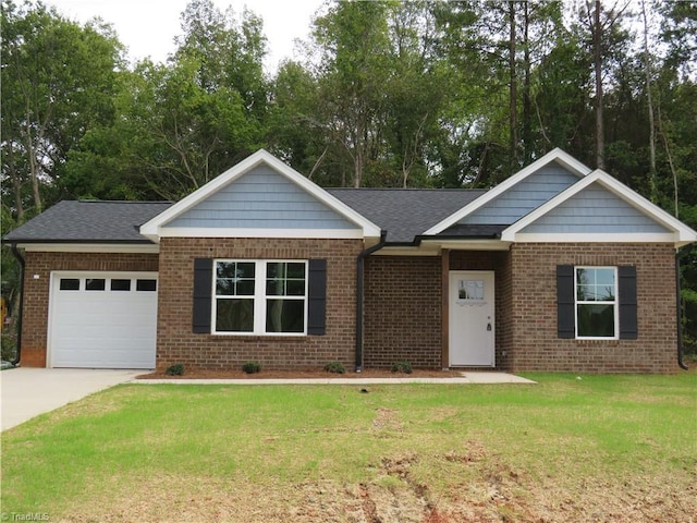 view of front of house with a garage, a front yard, and brick siding