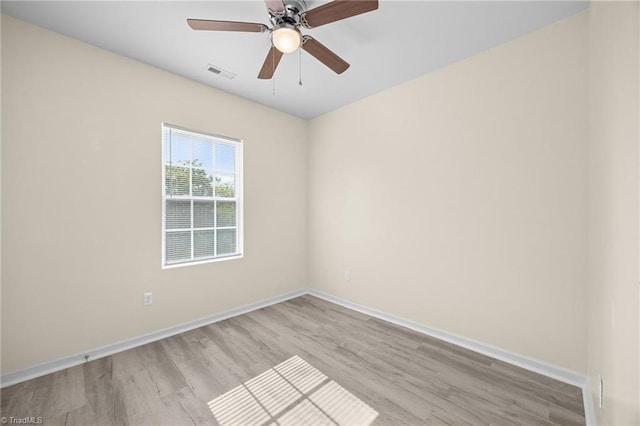 907 Caldwell St, Greensboro, NC 27406 - unfurnished room with wood finished floors, baseboards, and ceiling fan