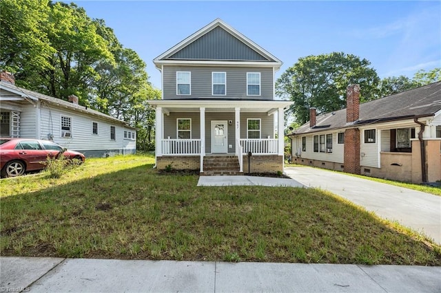 907 Caldwell St, Greensboro, NC 27406 - view of front of property featuring a porch, board and batten siding, a front lawn, and concrete driveway