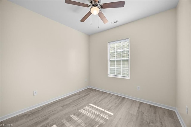 907 Caldwell St, Greensboro, NC 27406 - unfurnished room featuring light wood-type flooring, baseboards, and ceiling fan