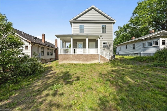 907 Caldwell St, Greensboro, NC 27406 - rear view of property with covered porch and a lawn