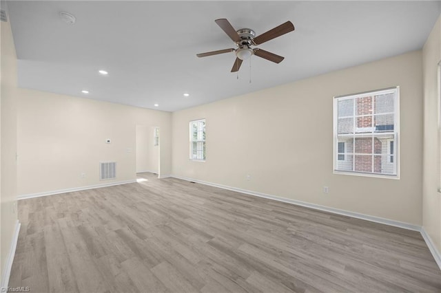 907 Caldwell St, Greensboro, NC 27406 - unfurnished room featuring baseboards, wood finished floors, ceiling fan, recessed lighting, and a smoke detector