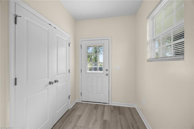 907 Caldwell St, Greensboro, NC 27406 - doorway to outside with light wood-style floors and baseboards