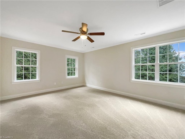 unfurnished room with ceiling fan and carpet floors