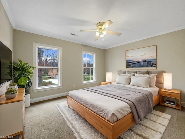 bedroom with ornamental molding and ceiling fan