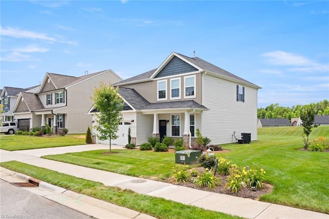 1827 Deveron Ct, Kernersville, NC 27284 - view of front facade with concrete driveway, a front yard, a garage, and covered porch