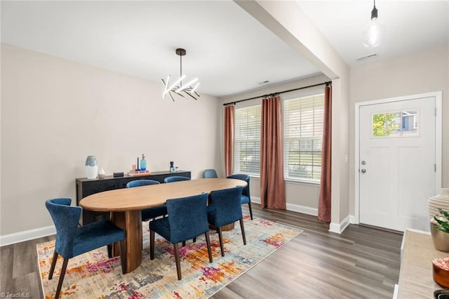 1827 Deveron Ct, Kernersville, NC 27284 - dining space featuring wood finished floors and a chandelier