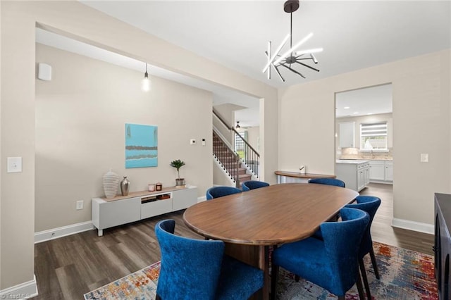 1827 Deveron Ct, Kernersville, NC 27284 - dining area featuring wood finished floors, stairs, and a chandelier