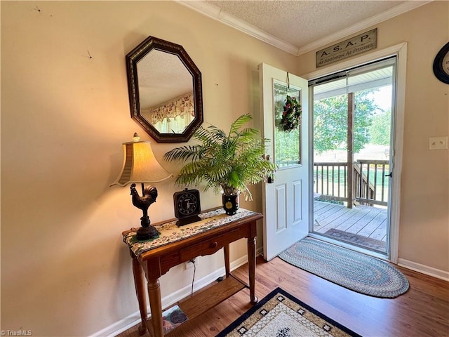 7658 Salem Chapel Rd, Walnut Cove, NC 27052 - doorway with wood finished floors, crown molding, and a textured ceiling