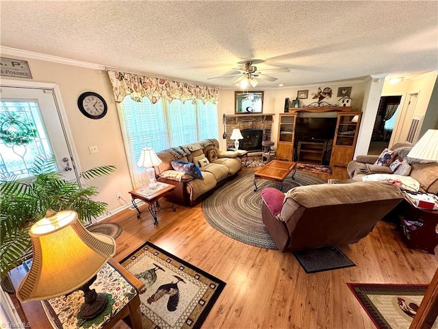 7658 Salem Chapel Rd, Walnut Cove, NC 27052 - living room featuring a textured ceiling, ceiling fan, wood finished floors, and ornamental molding