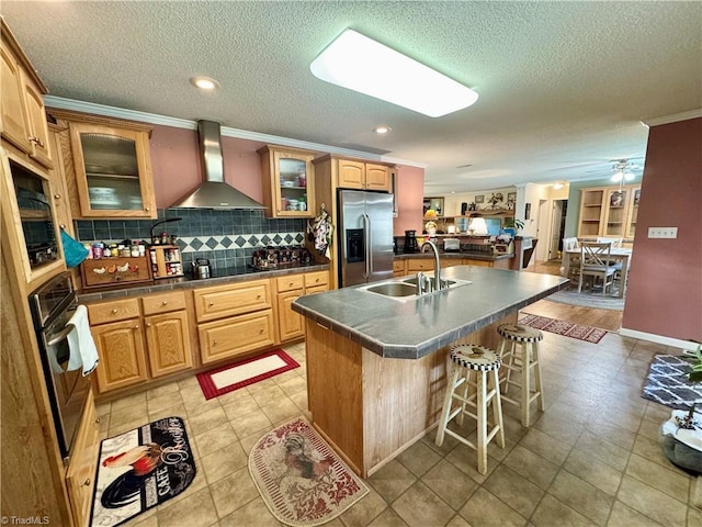 7658 Salem Chapel Rd, Walnut Cove, NC 27052 - kitchen with appliances with stainless steel finishes, wall chimney range hood, a breakfast bar, backsplash, and dark countertops