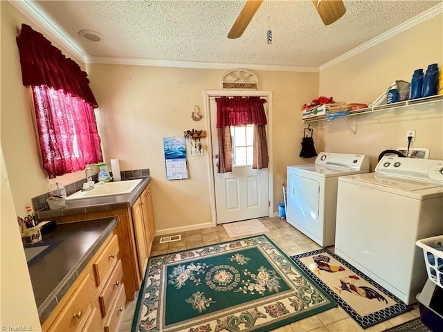 7658 Salem Chapel Rd, Walnut Cove, NC 27052 - washroom featuring washing machine and clothes dryer, a textured ceiling, a ceiling fan, cabinet space, and crown molding