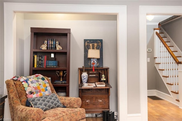 living area with hardwood / wood-style floors