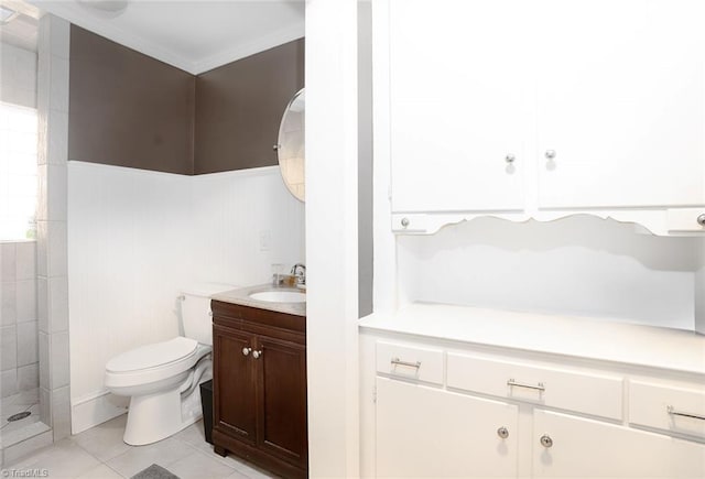 bathroom with walk in shower, vanity, toilet, and tile patterned floors