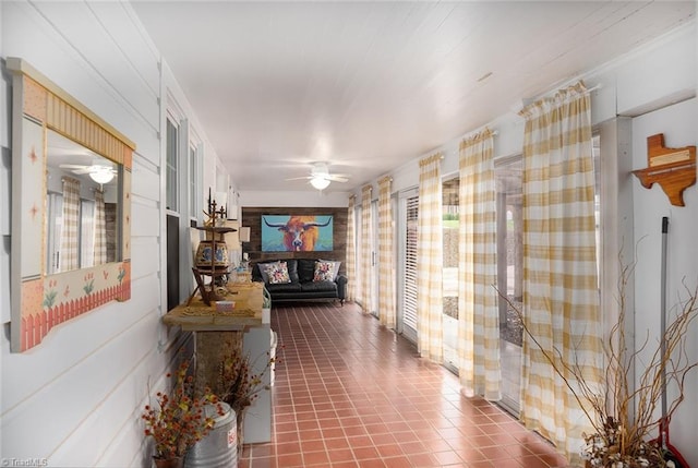 hall with dark tile patterned floors