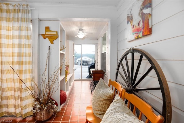 hall featuring crown molding and tile patterned floors