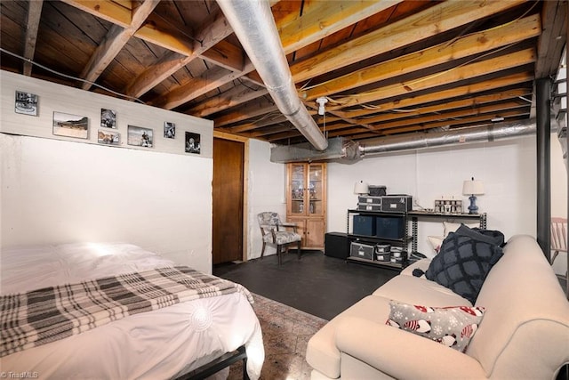 bedroom featuring concrete flooring