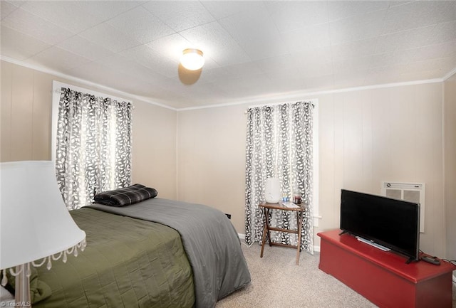 bedroom featuring carpet floors and crown molding