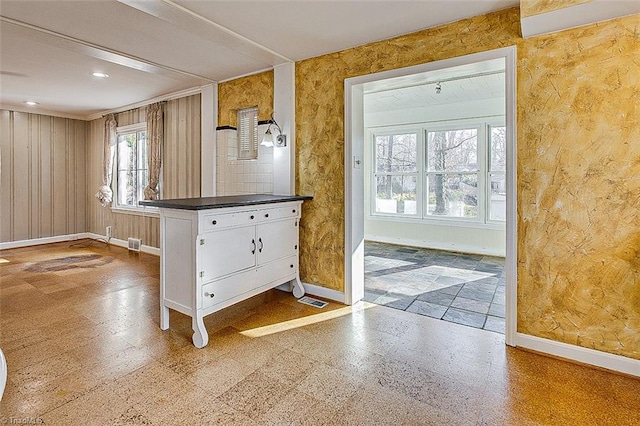 entryway with wooden walls