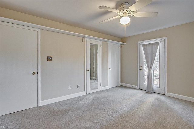 carpeted empty room with ceiling fan