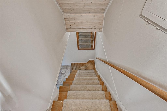 stairway with wooden ceiling