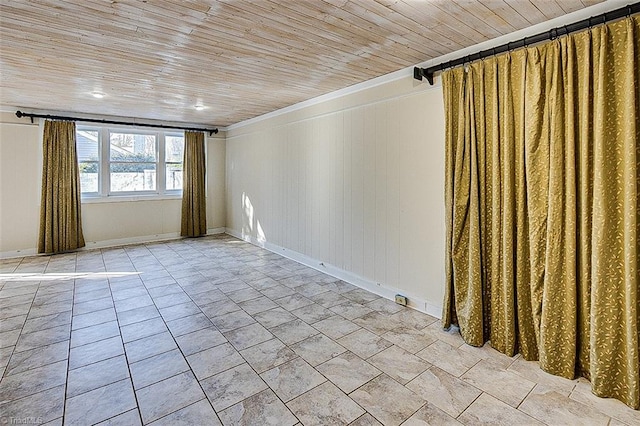 unfurnished room with wooden walls and wood ceiling