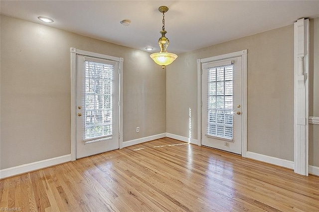 doorway with hardwood / wood-style floors