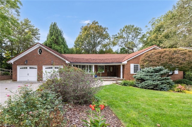 single story home featuring a front lawn and a garage