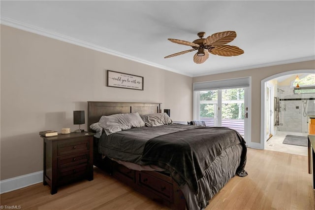 bedroom with crown molding, light hardwood / wood-style flooring, ensuite bathroom, and ceiling fan